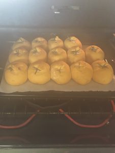 Pumpkin Rosemary Dinner Rolls baking with steam