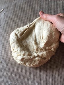 Once the dough rests, the gluten relaxes making it easier to knead. See how nuch smoother it is?
