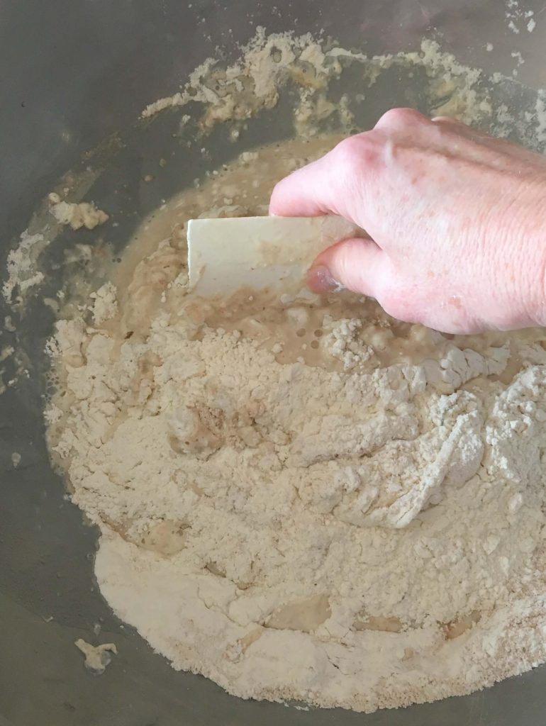 Mixing the dough with a scraper