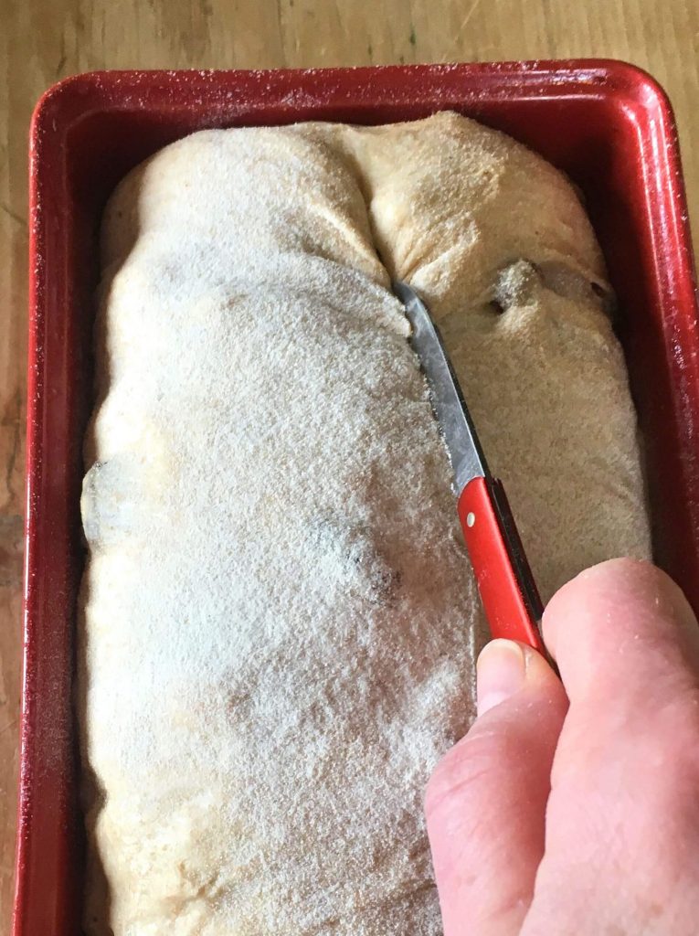 score the dough with a serrated knife before baking