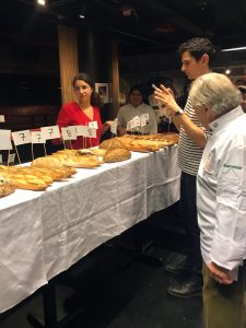 Charlie van Over studying the array of baguettes at Best baguette New York 2019