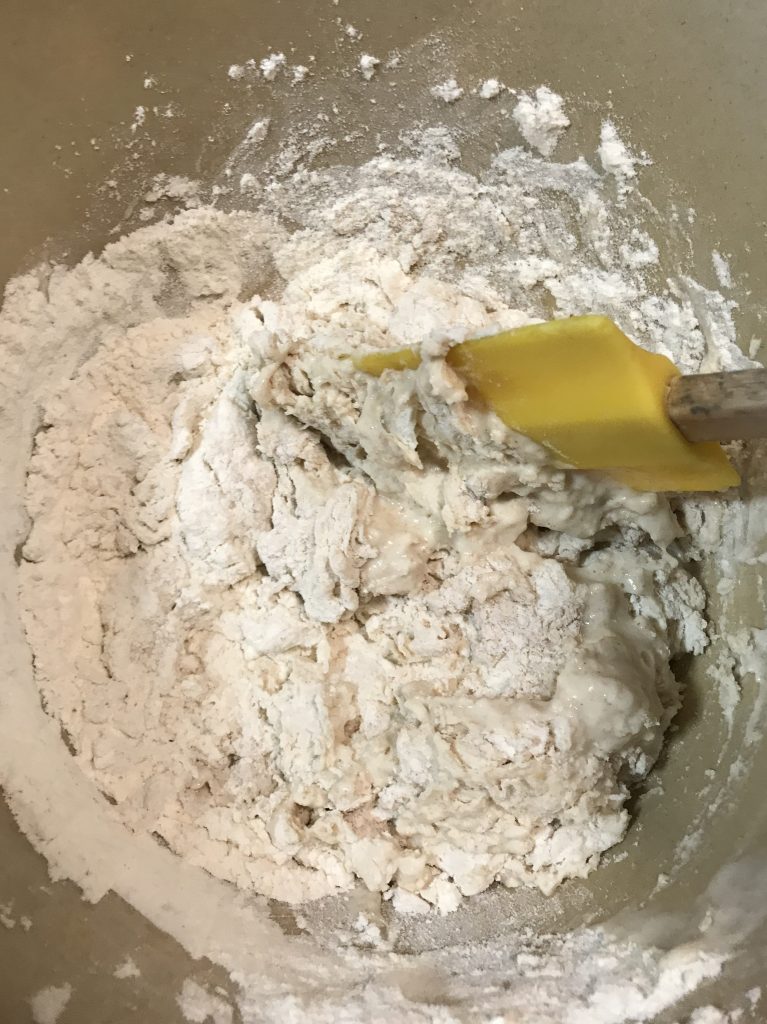 Stirring experimental no knead bread dough