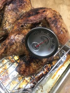 Oven BBQ Roast Turkey testing doneness to 165