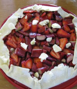 strawberry Rhubarb Almond Tart The unbaked tart sprinkled with sugar and butter