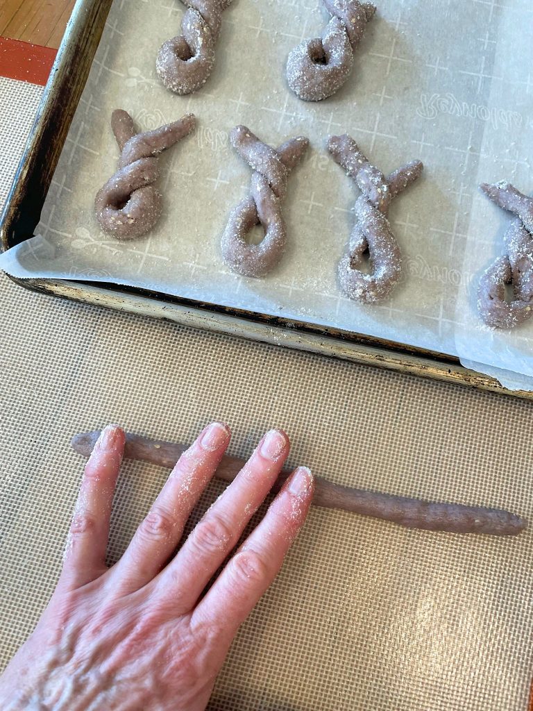10 Biscotti di Vino rolling dough into snake