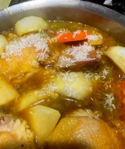 Adding rice Chicken Curry with Green Almonds, Carrots and Turnips